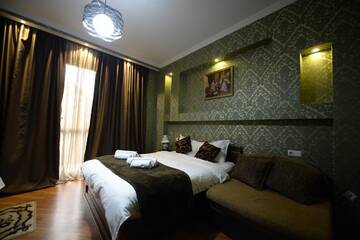 Фото номера Большой двухместный номер с 1 кроватью Отель Begi Hotel г. Тбилиси 6