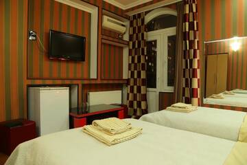 Фото номера Стандартный трехместный номер Отель Dkd-bridge Hotel г. Тбилиси 8