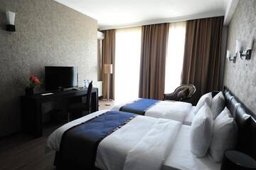 Фото номера Стандартный двухместный номер с 2 односпальными кроватями Отель Best Western Tbilisi Art Hotel г. Тбилиси 7