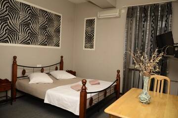 Фото номера Двухместный номер с 1 кроватью Отель Mkudro Hotel г. Тбилиси 10