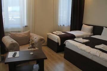 Фото номера Семейный номер Делюкс Отель GSG Hotel г. Тбилиси 2