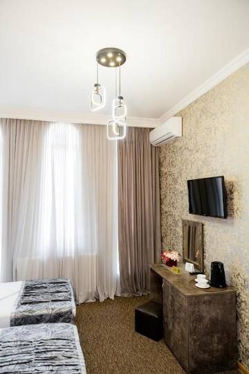 Фото номера Двухместный номер с 2 отдельными кроватями Отель Hotel Makona г. Тбилиси 4