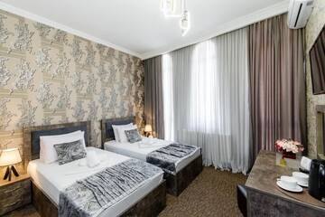Фото номера Двухместный номер с 2 отдельными кроватями Отель Hotel Makona г. Тбилиси 5