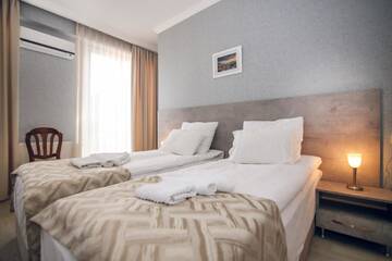 Фото номера Стандартный двухместный номер с 2 отдельными кроватями Отель Hotel Kenari г. Тбилиси 5