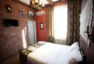 Фото номера Двухместный номер Делюкс с 1 кроватью Отель Marani Boutique Hotel г. Тбилиси 10