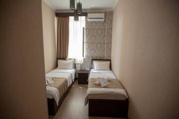 Фото номера Двухместный номер с 2 отдельными кроватями Отель Otiums Hotel г. Тбилиси 2