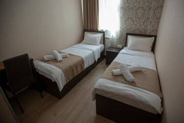 Фото номера Двухместный номер с 2 отдельными кроватями Отель Otiums Hotel г. Тбилиси 4