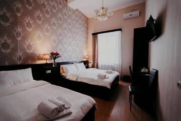 Фото номера Трехместный номер с видом на город Отель Otiums Hotel г. Тбилиси 5