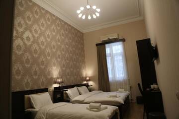 Фото номера Стандартный семейный номер Отель Otiums Hotel г. Тбилиси 3
