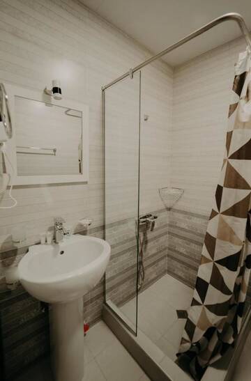 Фото номера Стандартный семейный номер Отель Otiums Hotel г. Тбилиси 4