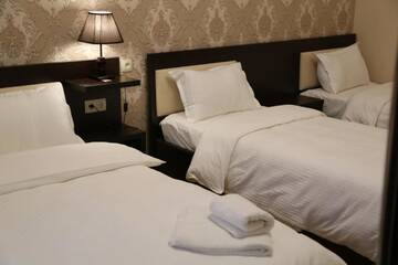 Фото номера Стандартный семейный номер Отель Otiums Hotel г. Тбилиси 9