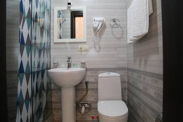 Фото номера Стандартный двухместный номер с 2 отдельными кроватями Отель Otiums Hotel г. Тбилиси 5